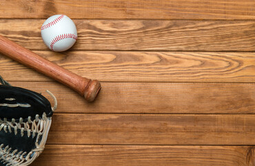 Baseball bat, glove and ball on wooden floor.  Sport theme background with copy space for text and advertisment