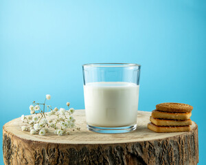 Glass of milk standing on old wooden table