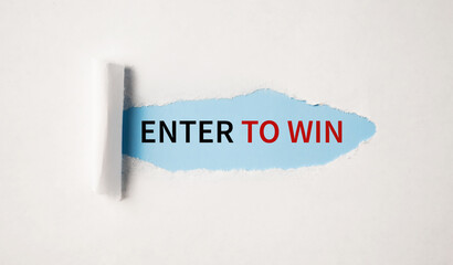 Enter to Win appearing behind torn white paper.