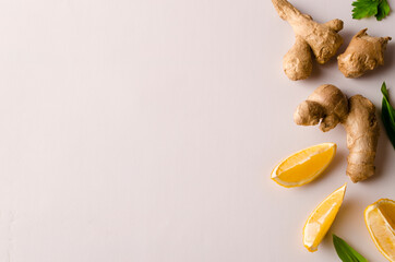 Fresh lemon slices, ginger, on white background. Fresh vitamins.Place for text. Increased immunity.