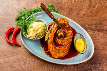 Baked pork knee, pork knuckle and sauerkraut.