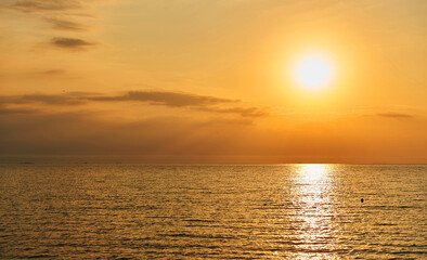 Obraz premium Amazing Sunset on the Sea. Adriatic sea, beautiful sunset, waves and landscape. Lignano Sabbiadoro, Italy.