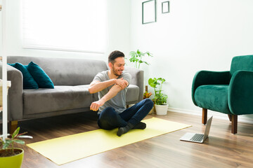 Happy man starting a home workout in the living room