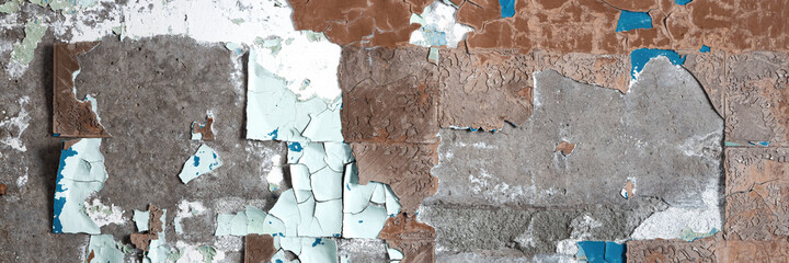 Rough brown wall texture with pieces of glue and stucco in place of old tile. Wide panoramic texture for background and design.