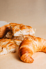 Cheese snail, croissant and bread. Bakery products. Homemade cheese snail. Pastries for breakfast. Copy paste space 