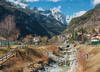 Famous spectacular view of the commune of Molveno in early spring in sunny day. Countryside in Dolomites Alps, Italy