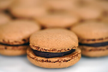 French macaron cookies filled with chocolate ganache cream