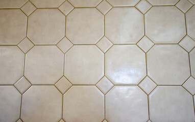 Octagonal and triangular white tile with grout lines