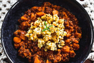 vegan pumpkin lentil and mushroom curry with truffle potato topping, healthy plant-based food