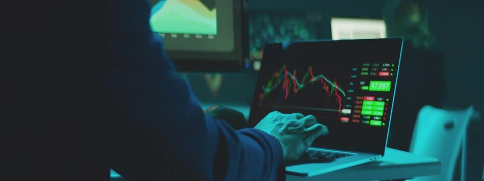 Professional Financial Data Analysts Working in a Modern Monitoring Office with Live Analytics Feed on a Digital Screens.
