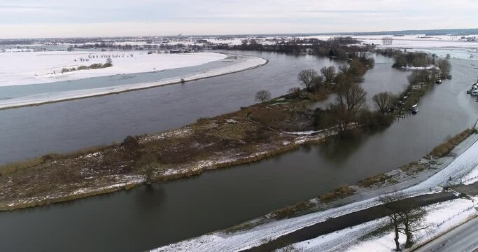 Drone shot from a river in The Netherlands in the winter time
