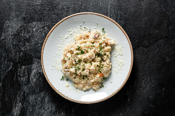 risotto with seafoods (shrimps, mussels, octopus, clams) and tomatoes