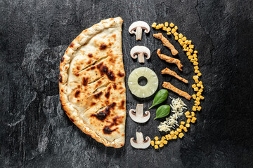 tasty italian calzone pizza with fresh ingredients and vegetables