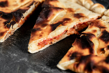 tasty italian calzone pizza with fresh ingredients and vegetables