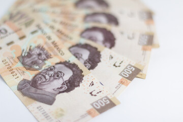 Set of Mexican 500 pesos bills on white background.