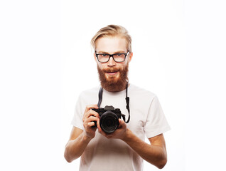 Fototapeta premium Portrait of a smiling handsome man holding camera