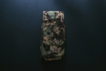 Camouflage magazine pouch on black background. Camo pouches. Navy. Army