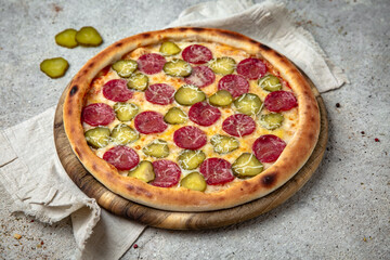Tasty hot italian pizza with pepperoni and pickles. Pizzeria menu. Concept poster for Restaurants or pizzerias. 