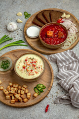 Beetroot red Ukrainian borsch and creamy chicken soup with grilled vegetables. Balanced tasty diet food. First course