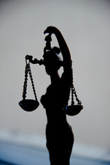 Libra of Themis, silhouette of the figure of the goddess of justice.