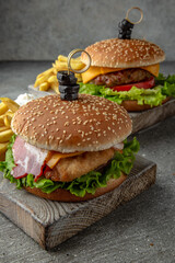 Delicious juicy burgers from Brioche Bun, fresh vegetables, delicious. Hamburger for poster or menu. Free space for text.