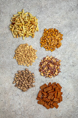 Snacks for beer. Assorted salted nuts and crunchy croutons. Octoberfest party dinner. Festive table with delicious food.