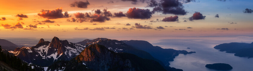 Panoramic landscape view of Howe Sound during a vibrant summer morning. Dramatic Sunrise Sky Art Render. Taken from the top of Brunswick Mountain, North of Vancouver, BC, Canada. Nature Background