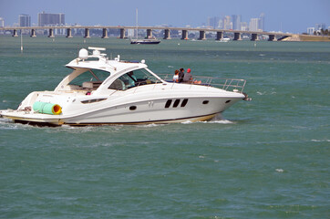 Fototapeta premium White motor yacht cruising on the Florida Intra-Coastal Waterway.