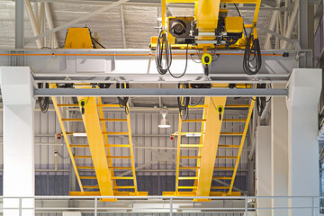 Overhead crane inside factory or warehouse. That industrial machinery or lifting equipment consist...