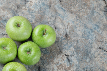 Green apple isolated on concrete background