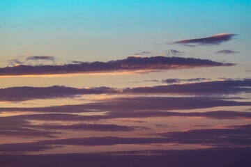 This image shows a dream like sky filled with vibrant and colorful sunset clouds.