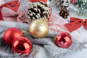 Christmas shiny baubles on white surface