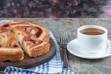 Sweet pie served with a cup of coffee