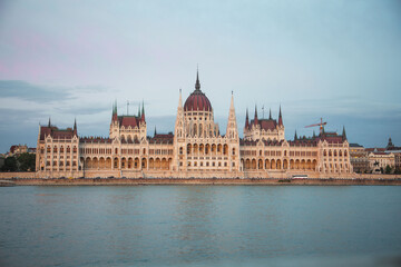 Fototapeta na wymiar Sunset over the Hungarian Parliament Building Országház and Danube River, Budapest, Hungary