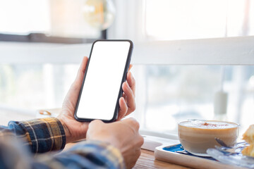 cell phone blank white screen mockup.woman hand holding texting using mobile on desk at office.background empty space for advertise.work people contact marketing business,technology