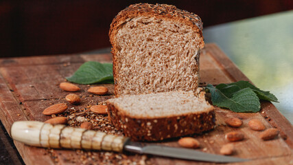Fresh homemade whole wheat bread on a wooden board.