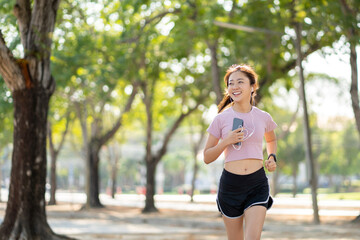 Healthy Asian woman jogging in the morning in the park, sport concept.