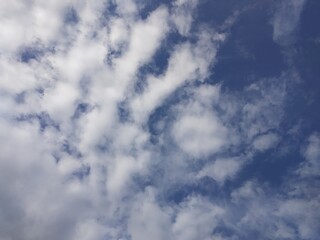white clouds and blue skies in the morning