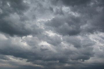 Grey rain clouds all over the sky.