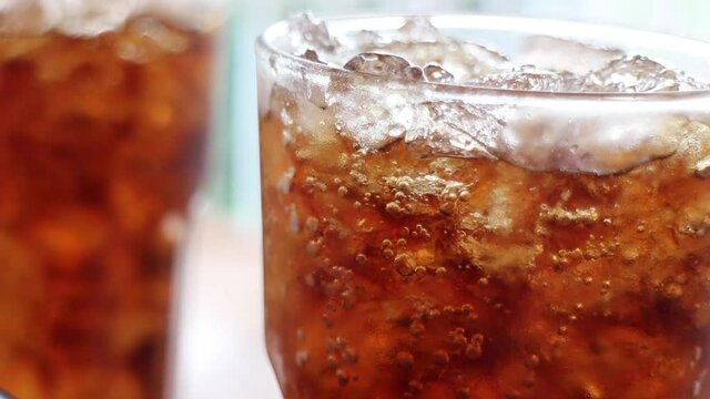 Iced glass of soft drink, stock footage