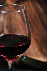 Close up a glass of red wine on dark background
