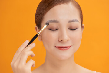 Fototapeta premium Beauty Asian Girl with Cosmetics Makeup.