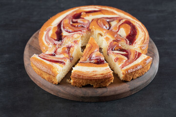 Obraz na płótnie Canvas Soft yummy pie with mixed ingredients on a wooden board