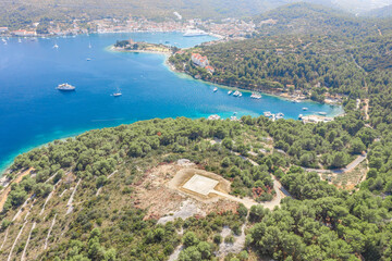 Fototapeta na wymiar Aerial drone shot of Heliport on top of hill near port of Vis Island in Croatia summer