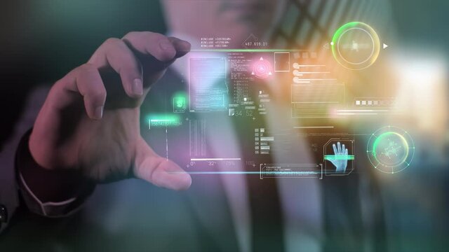 A man holds a gadget with infographic data in his hands.