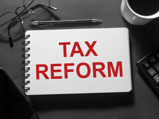 Tax Reform, text words typography written on book against dark background, life and business motivational inspirational