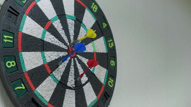 Throwing three darts into the target aim and missing a ten points circle. making mistakes, failure leads to success, imperfection achieving goals concept 4k UHD video