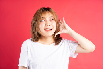 Young asian girl with cheerful gestures and expressions on background