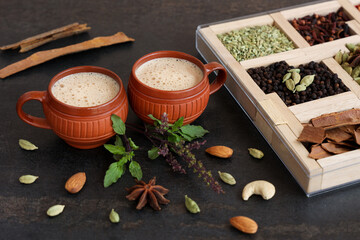 Top view of Indian herbal Masala Chai or traditional beverage tea with milk and spices Kerala...