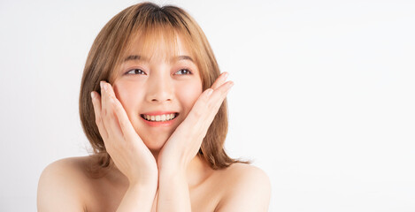 Beautiful xing woman with fresh skin smiling on background